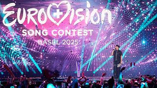 Winner of the Eurovision Song Contest JJ from Austria holds up the trophy onstage in Basel, 18 May, 2025 