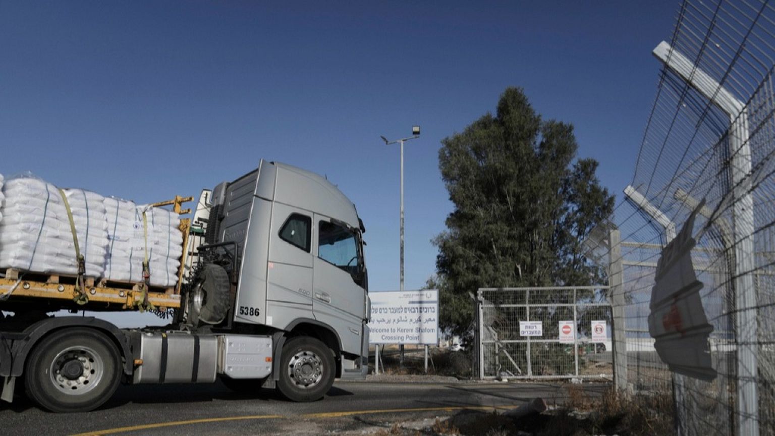 A truck carrying humanitarian aid for the Gaza Strip enters to Kerem Shalom Crossing in southern Israel, Tuesday May 20, 2025