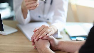 A doctor discusses a patient's diagnosis.