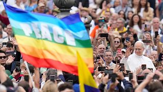 Pope Leo XIV waves to faithful as he arrives for his first weekly general audience in St Peter's Square at The Vatican, 21 May, 2025