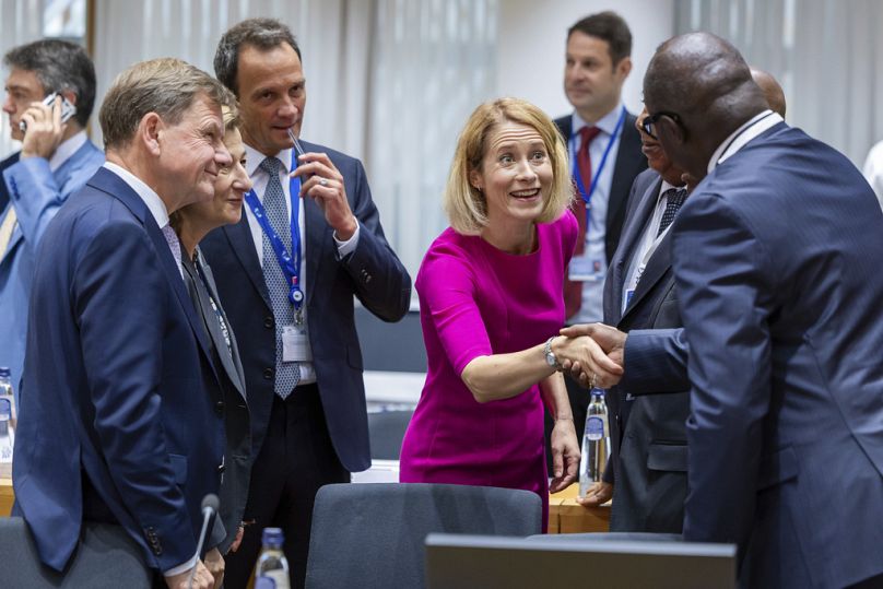 European Union foreign policy chief Kaja Kallas, center, and Germany's Foreign Minister Johann Wadephul, left, greet ambassadors as they arrive for the European Union-African 