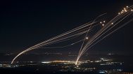 The Israeli Iron Dome air defense system fires to intercept an attack from Lebanon over the Galilee region as seen from the Israeli-annexed Golan Heights, on August 4, 2024.