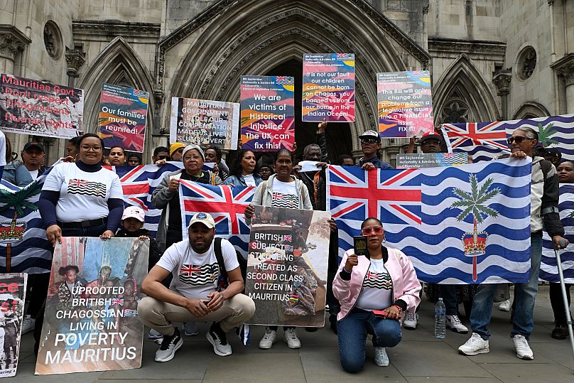 People demonstrate outside the High Court in London after a court blocked the UK from transferring sovereignty over the Chagos Islands to Mauritius, 22 May, 2025