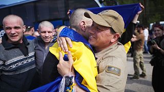 Recently swapped Ukrainian prisoners of war hug after a prisoner exchange, 23 May, 2025