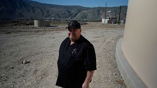 Mark Whaling, a retired firefighter, stands in front of a Heli-Hydrant.