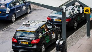 Taxi cars parked outside the central station in Stockholm.