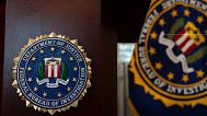 An FBI seal is displayed on a podium before a news conference at the field office in Portland, 16 January, 2025