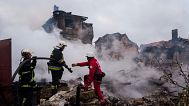 Rescue workers extinguish a fire of a house destroyed by a Russian strike in Markhalivka village, Kyiv region, Ukraine, Sunday, May 25, 2025. (AP Photo/Evgeniy Maloletka)