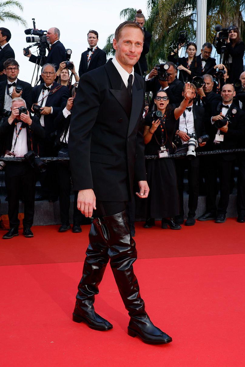 Alexander Skarsgård rocked some rather kinky, attention-grabbing thigh-high Saint Laurent boots at The Phoenician Scheme premiere.