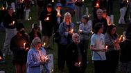 People attend a candlelight vigil at Say Their Names Cemetery on the five-year anniversary of George Floyd's death, Sunday, May 25, 2025, in Minneapolis.