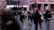 German shoppers stroll through a city street