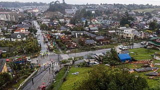 Some homes are roofless the day after tornado hit Puerto Varas, Chile, Monday, May 26, 2025.