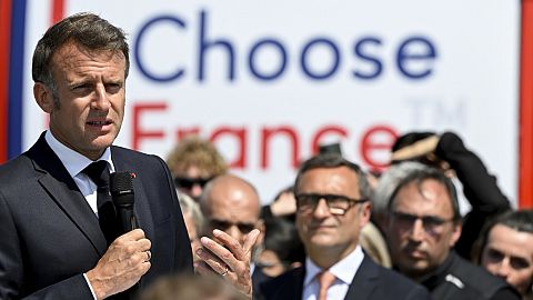 French President Emmanuel Macron speaks at the Daimler Buses factory as part of the 8th Choose France summit aimed at attracting foreign investments in France, 19 May 2025..