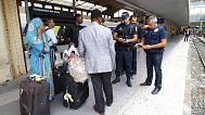 French police officers check identity documents at the Saint-Charles train station, in Marseille.