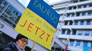 A participant demands the delivery of Taurus cruise missiles to Ukraine on a poster at a solidarity rally for Ukraine at the Kornmarkt in Nuremberg, Germany, Saturday, Feb. 24