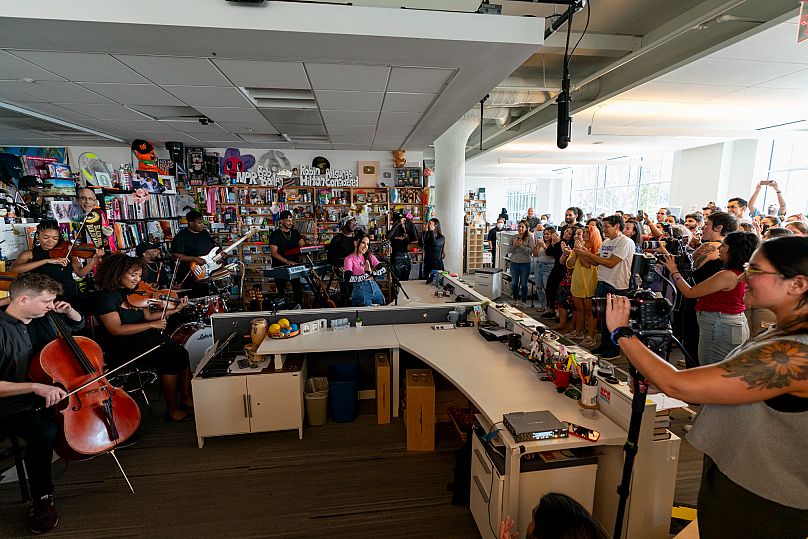 An audience watches while Becky G performs during a taping for NPR's Tiny Desk concert series in Washington, 30 August, 2023