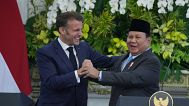 French President Emmanuel Macron holds hand with Indonesian President Prabowo Subianto after a press conference in Jakarta, 28 May, 2025