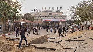 FILE: Palestinians inspect the site of an Israeli army airstrike on the European hospital in Khan Younis, Gaza Strip, Tuesday, May 13, 2025.
