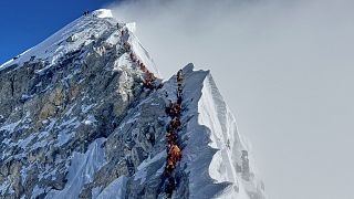 Mountaineers form a queue as they approach the summit of Mount Everest in Nepal, May 18, 2025. 