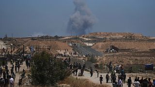 Smoke rises following an Israeli bombardment in southern Gaza as seen from Khan Younis, 29 May, 2025