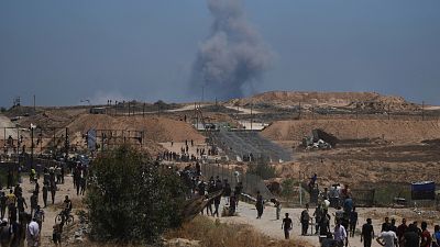 Smoke rises following an Israeli bombardment in southern Gaza as seen from Khan Younis, 29 May, 2025