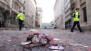 Rubbish lies on the street near the site where a car drove into football fans in Liverpool, 27 May, 2025