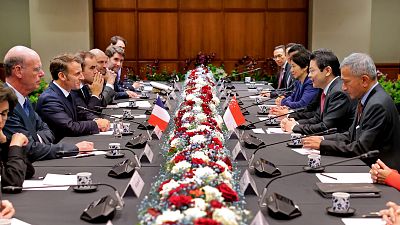 French President Emmanuel Macron with his cabinet meeting Singapore's Prime Minister Lawrence Wong and government officials in Singapore, 30 May 2025