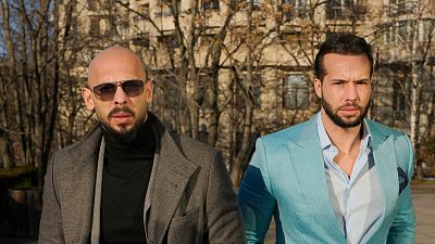  Andrew Tate, left, and his brother Tristan arrive at the Bucharest Tribunal in Bucharest, Romania, 1  February 2024. 