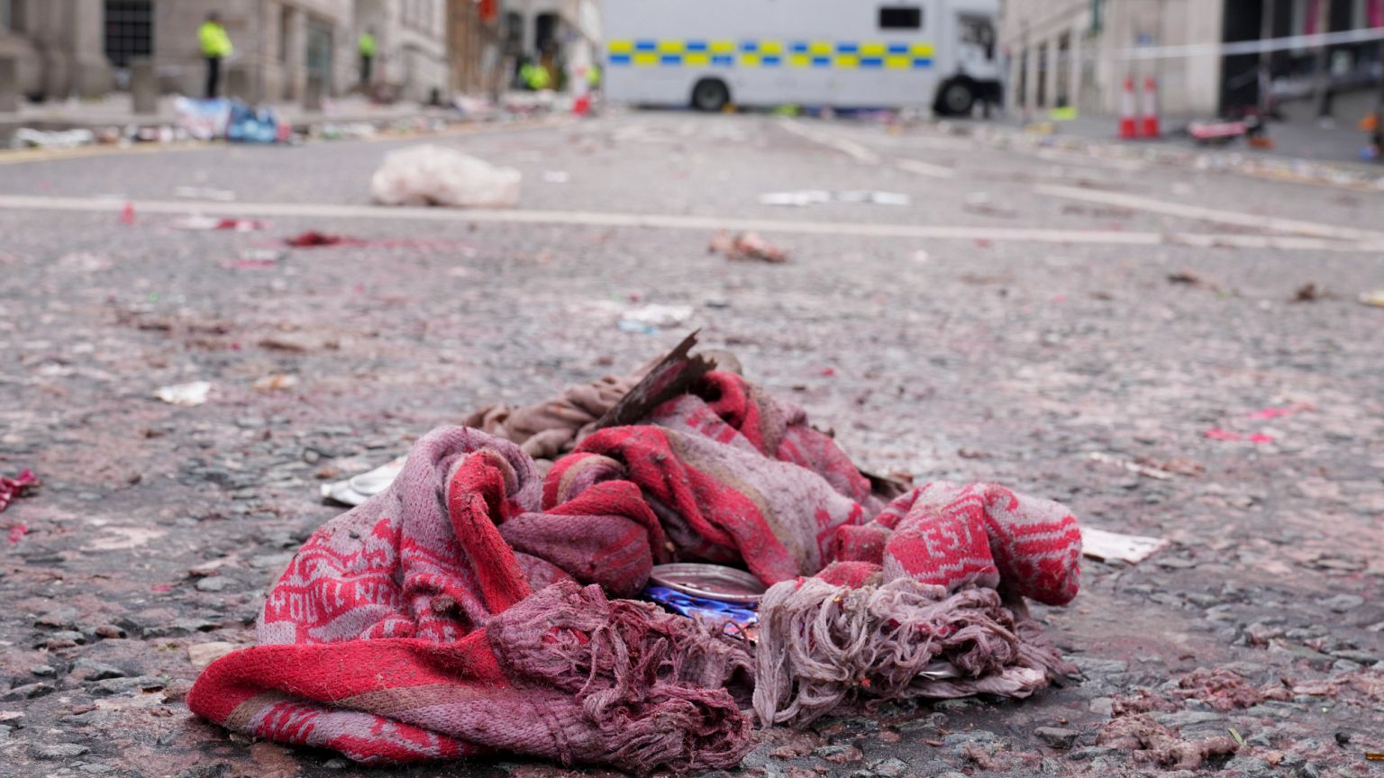 A fan scarf lies near the site where a minivan drove into the crowd in central Liverpool, 27 May, 2025 