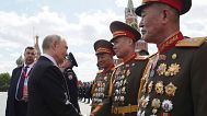Russian President Vladimir Putin speaks with North Korean officers after the Victory Day military parade in Moscow, Russia, 9 May 2025.