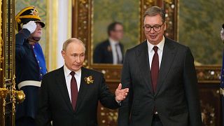 Russian President Vladimir Putin and Serbia's President Aleksandar Vucic enter the hall during their meeting in Kremlin, 9 May 2025