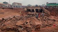 People search in flooded area following a downpour in Mokwa, Nigeria, Friday, May 30, 2025.