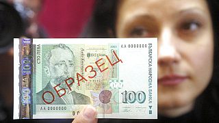 A model holds a BGN 100 banknote that was introduced Thursday, Dec. 4, 2003 in Sofia, Bulgaria.