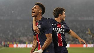 PSG's Desire Doue celebrates after scoring his side's second goal during the Champions League final soccer match between Paris Saint-Germain and Inter Milan at the Allianz Are