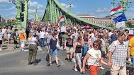 Silent demonstrators on their way down from the Liberty Bridge in Budapest, 1 June 2025