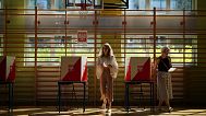 A woman prepares to cast her vote during the presidential election runoff in Warsaw, Poland, Sunday, June 1, 2025. 