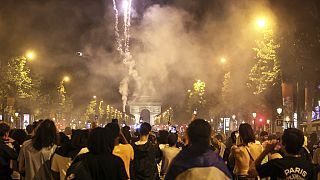 PSG supporters invade the Champs-Elysees avenue after the Champions League final soccer match between Paris Saint-Germain and Inter Milan, Saturday, May 31, 2025 in Paris. 