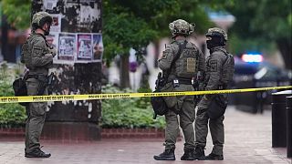 Law enforcement officials investigate after an attack on the Pearl Street Mall, Sunday, June 1, 2025, in Boulder, Colo.