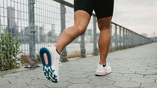 A jogger is shown from behind.