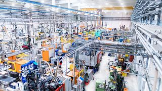 A modern plastic factory with industrial equipment.