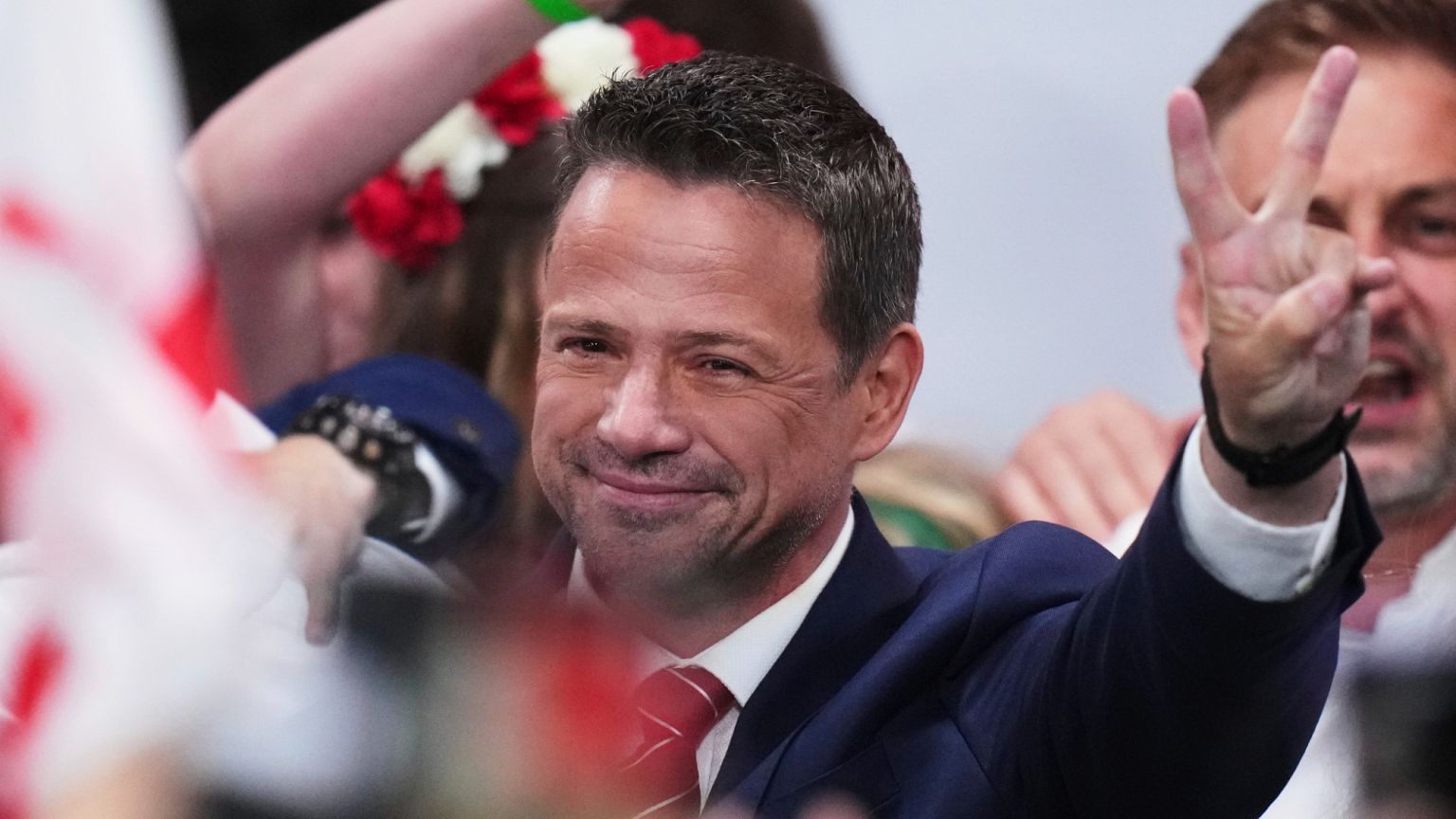 Rafał Trzaskowski greets supporters at his headquarters after the presidential election runoff in Warsaw, 1 June, 2025