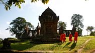 Cambodian Buddhist monks walk through the compound of Preah Vihear Temple near the Thai border, 12 November, 2013