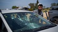 Basel Adra, Palestinian co-director of "No Other Land", looks at a damaged car after a settler's attack in the village of Susiya in Masafer Yatta - 25 March 2025