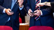 FILE - Two British bankers stand in the courtroom in Bonn, Germany, accused of helping dubious transactions with massive tax losses for the state of around 440 million.