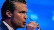 FILE: US Defence Secretary Pete Hegseth drinks water during the 22nd Shangri-La Dialogue summit in Singapore, 31 May 2025