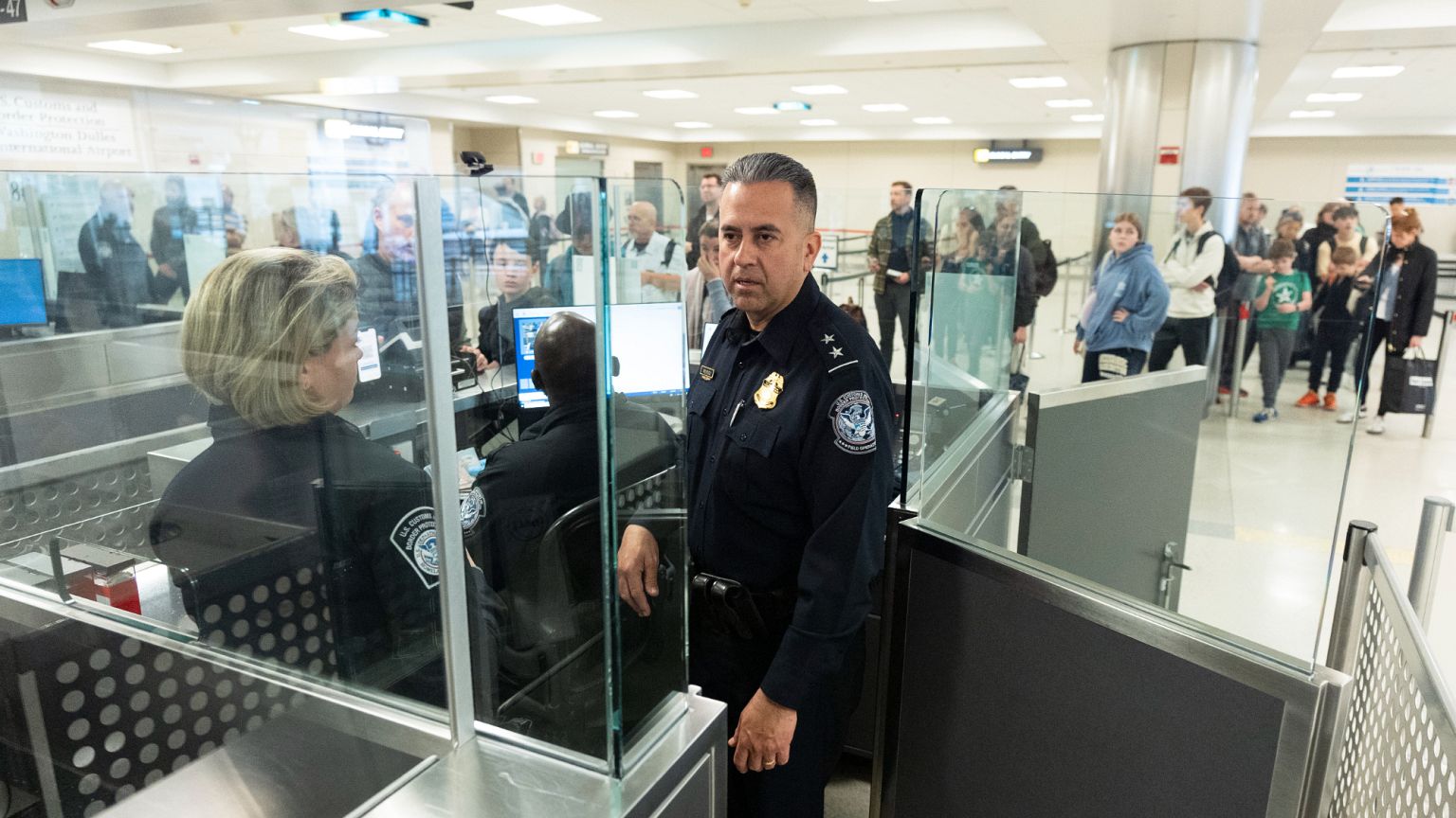 Customs officers observe the procedures in place in the port of entry at Washington Dulles International Airport, 1 April, 2024
