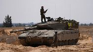 FILE: Israeli soldiers are seen near the border with the Gaza Strip, in southern Israel, 7 May 2024
