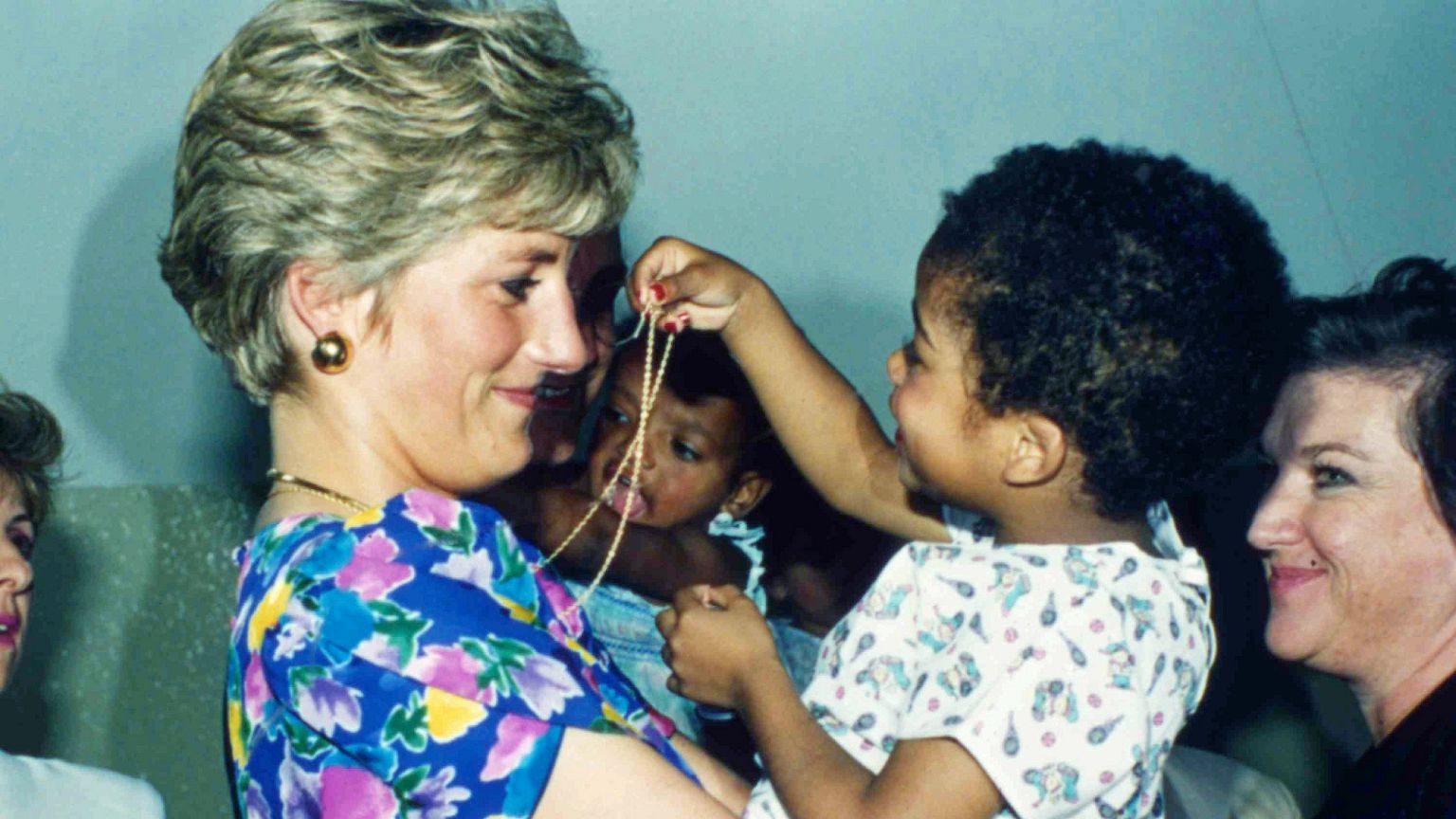 In this April 24, 1991 file photo, Princess Diana hugs and plays with an HIV-positive baby at Faban Hostel in São Paulo during her visit to Brazil.