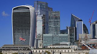 A general view of the skyline of the financial district, is seen by the River Thames, in London.
