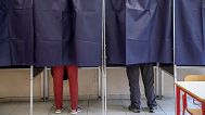 People vote the European elections at a polling station in Milan, 8 June, 2024